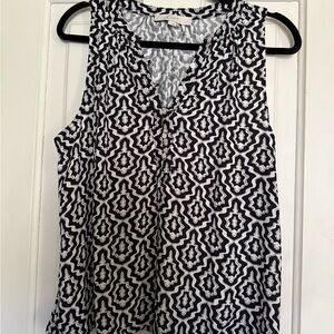 Black and White Sleeveless Blouse with Geometric Pattern